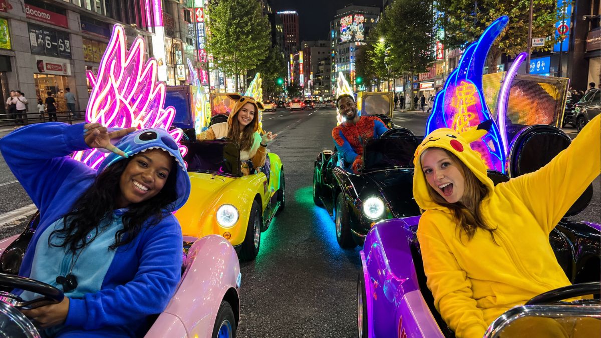 Street go-karts on a neon Akihabara street in Tokyo